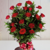 Ramo de flores fúnebres de 18 rosas rojas decoradas con verdes variados